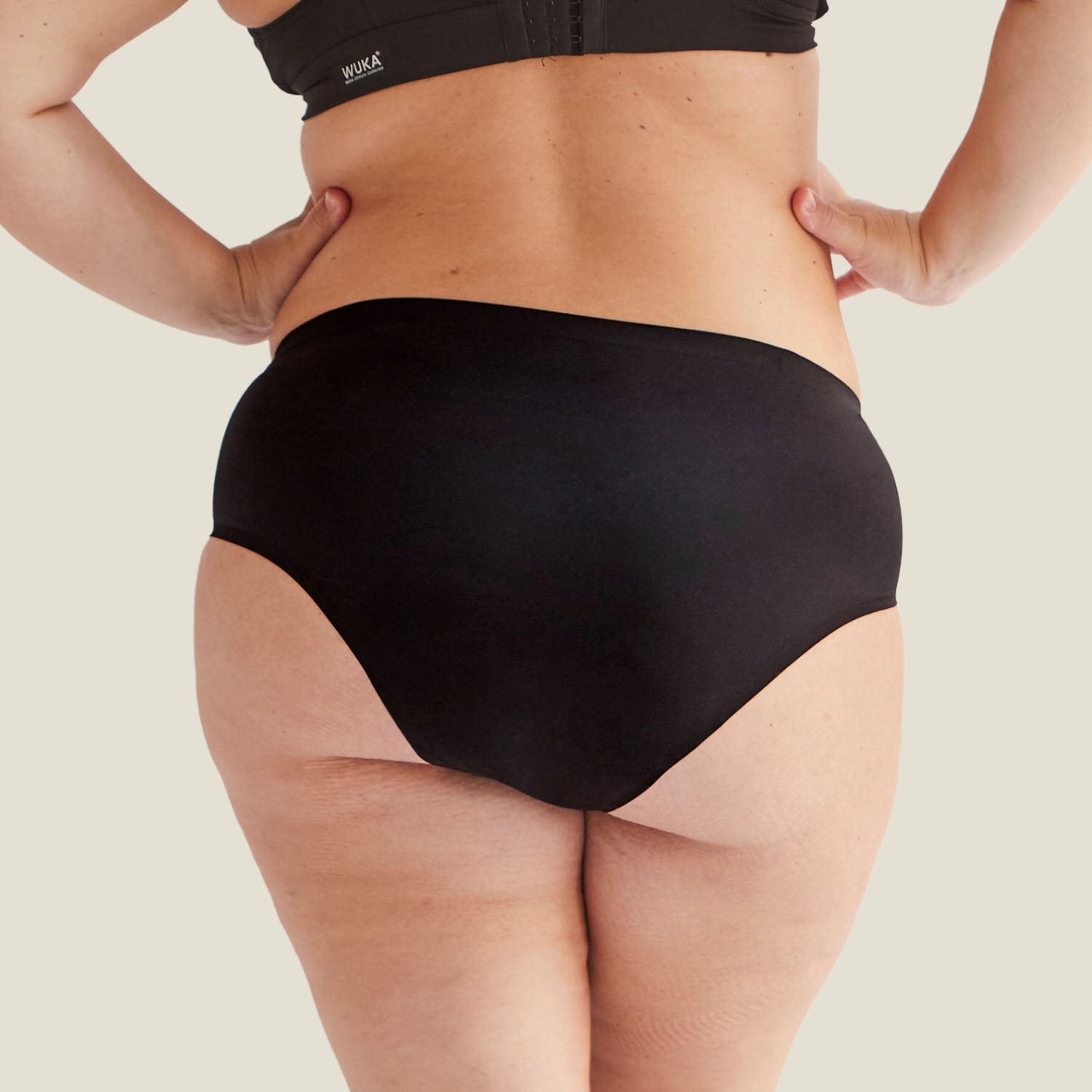 Back view of WUKA Stretch™ High Waist Postpartum Period Pants, showing seamless design and high waist for comfort and support.