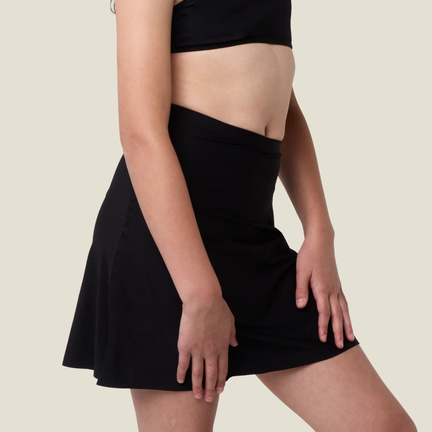 Side angle of WUKA Teen Seamless Period Skort — soft stretch fabric moves with you.