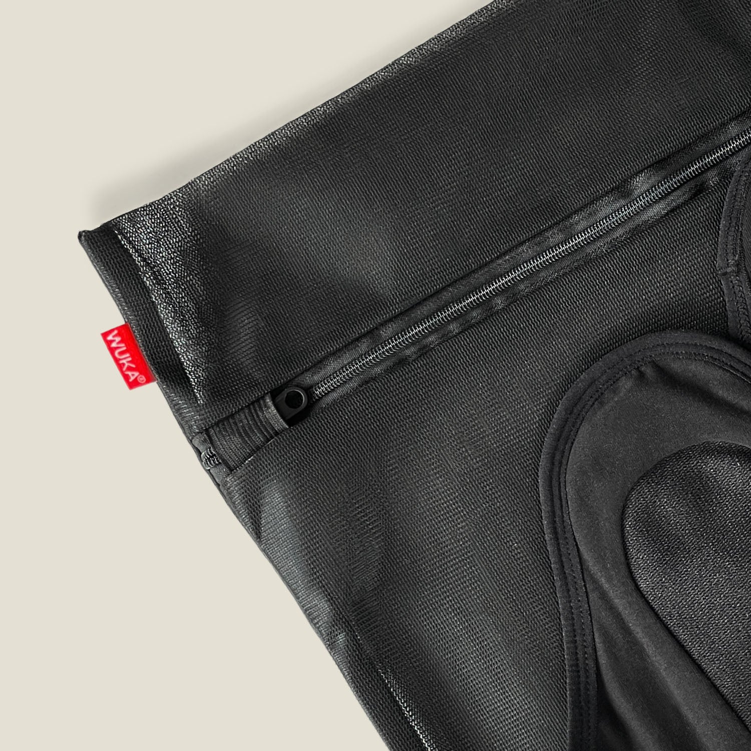 Close-up of WUKA mesh laundry bag zipper and fabric texture, designed for delicate washing of reusable period products.